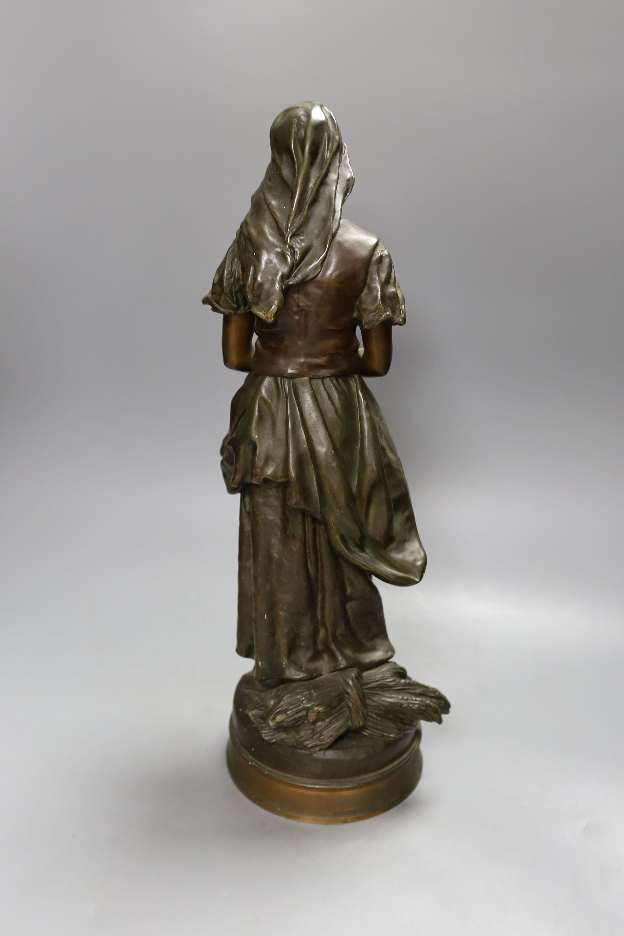 Emile Edmond Peynot (1850-1932), bronze of a girl with flowers in her apron 46cm